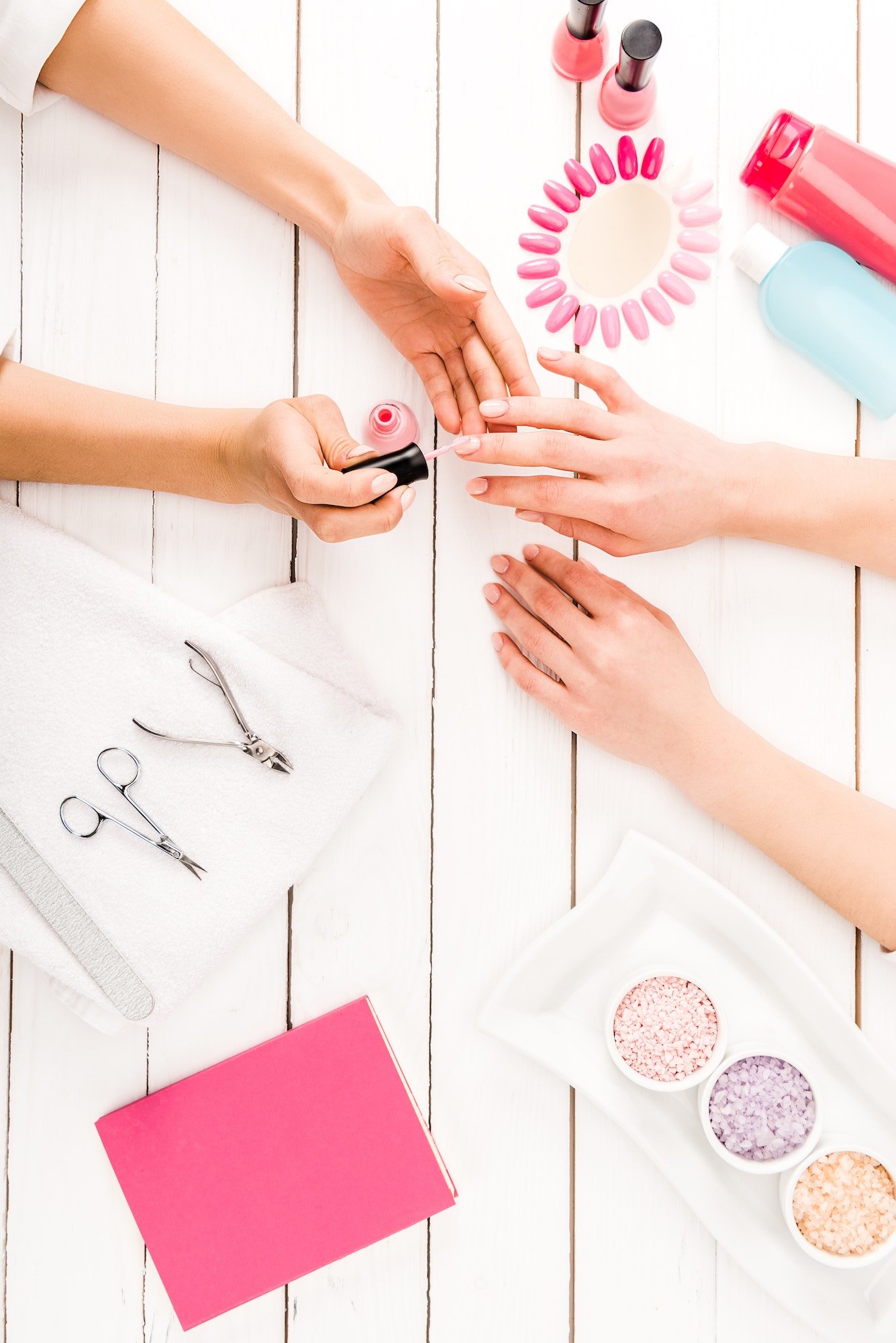 Flat lay with manicure instruments and nail polish palette